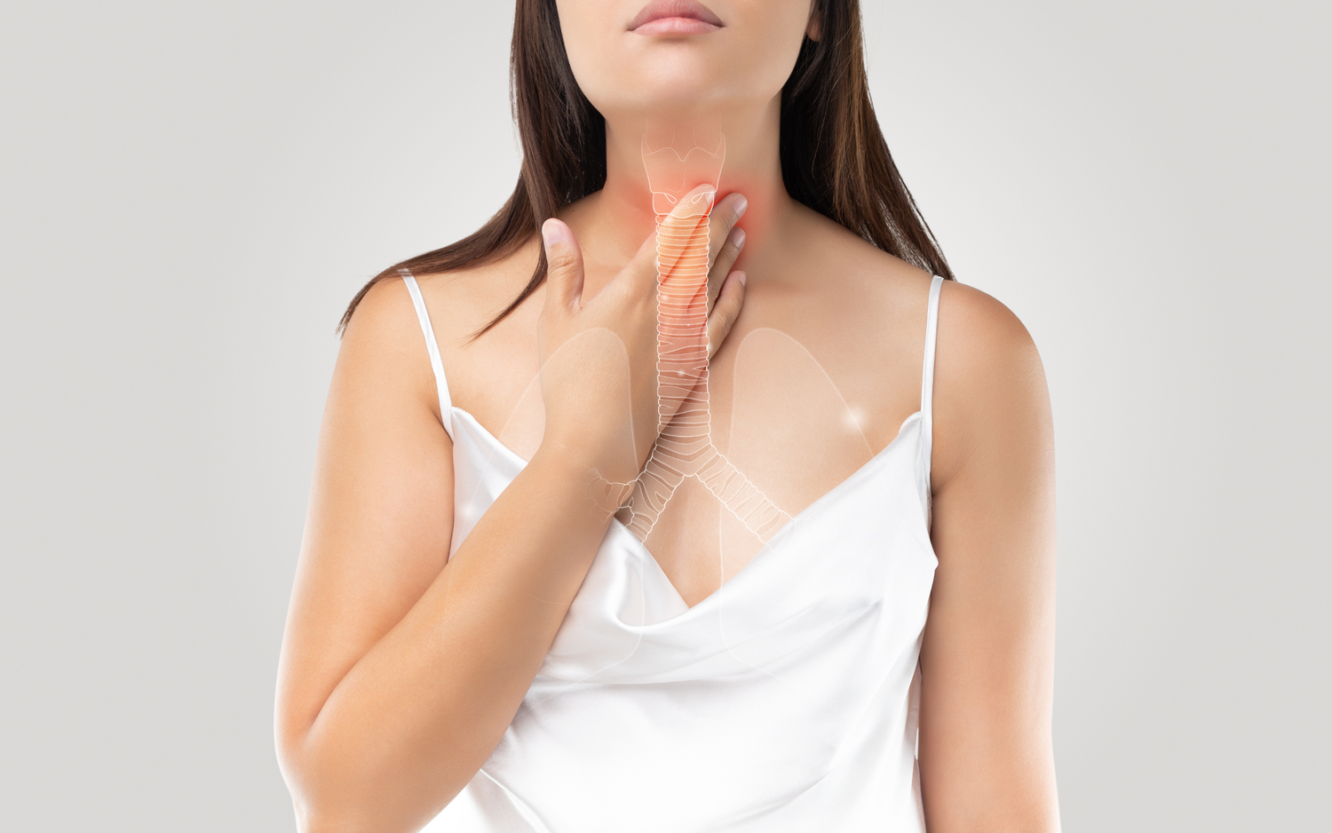 A woman touches her throat, where there is a transparent illustration of her oesophagus.